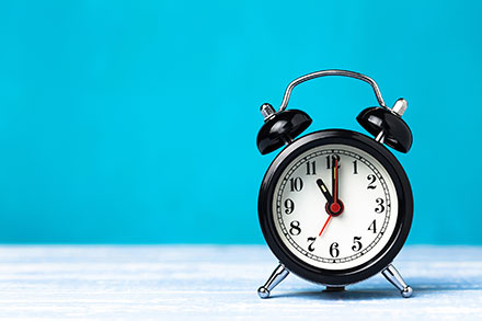 Alarm clock on a blue background