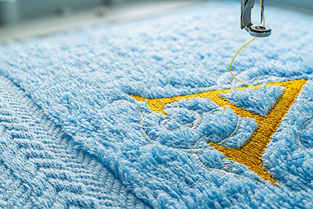 Embroidered letter A on a plush towel