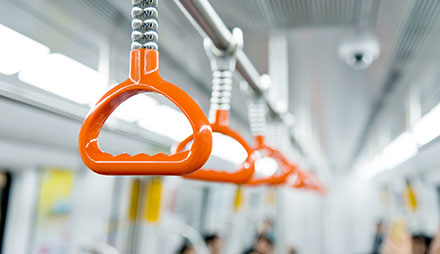 Close up of grab handles on a bus or train
