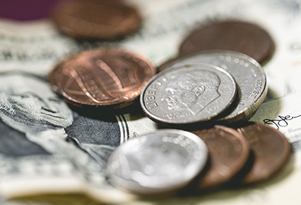 Pile of paper money and change