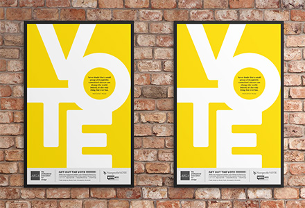 Posters encouraging citizens to vote on a brick wall