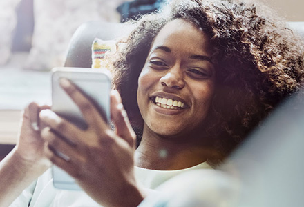 Smiling woman on a phone