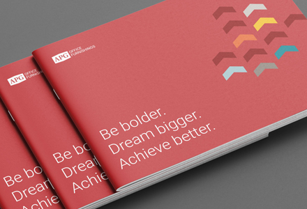 Photo of proposal covers with the tagline: Be bolder. Dream bigger. Achieve better.