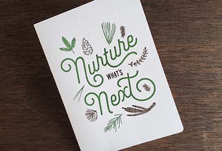 Greeting card with an illustrated cover saying "Nurture What's Next"
