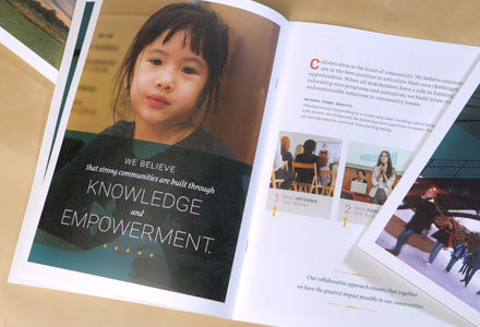 Photo of a brochure spread for Saint Paul and Minnesota Foundations. Image of a young girl with text across the photo.