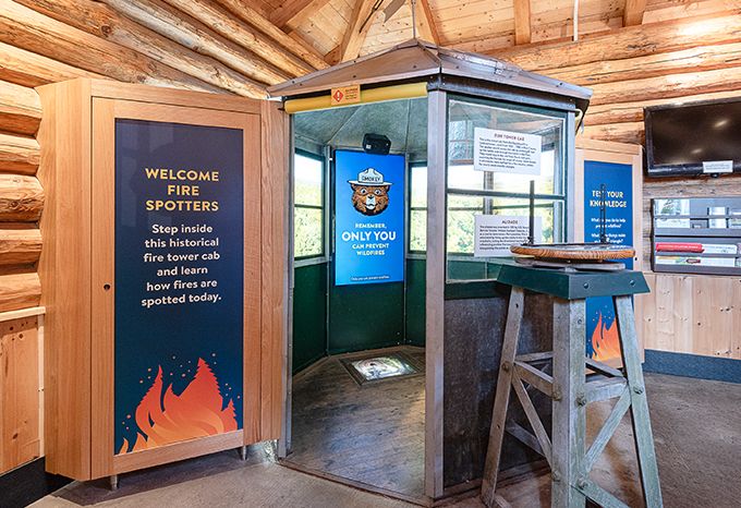 Interior of the DNR Fire Prevention Building at the Minnesota State Fair with a fire tower cab display and video