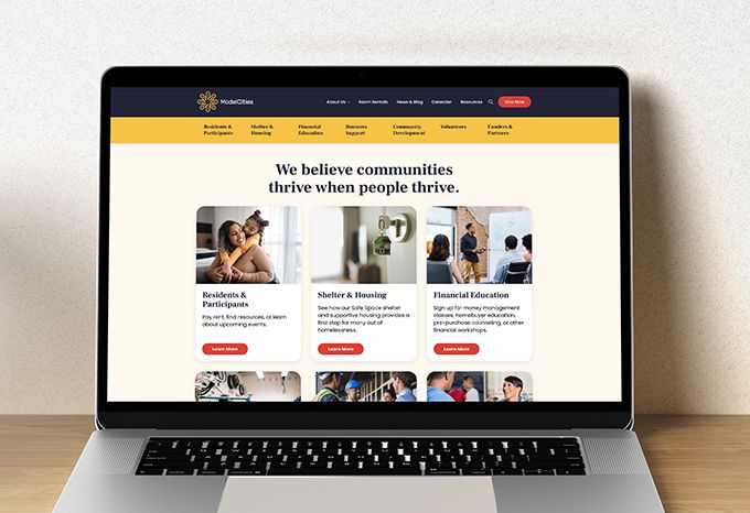 Laptop open to Model Cities' home page