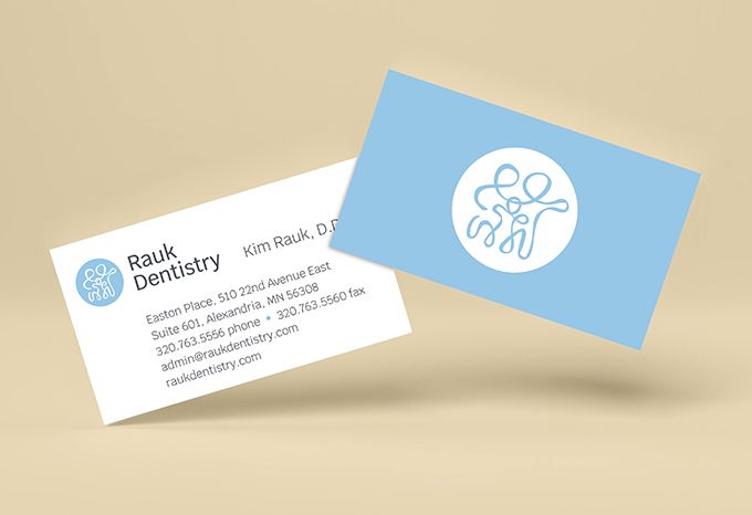 Business card for Rauk Dentistry with contact info on one side and a logo graphic on the back
